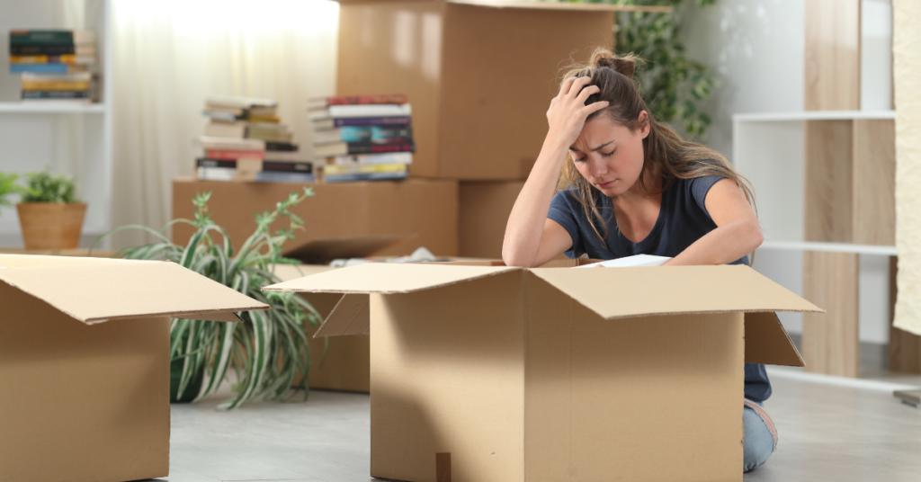 Woman unpacking boxes in her new home.
