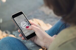 Woman Looking at a virtual tour on her smartphone