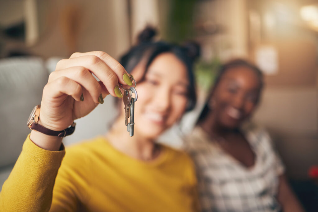 Hand, keys and new home or people moving in together. 