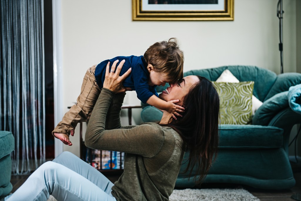 Mother and toddler playing at their new home Mother and toddler playing at their new home