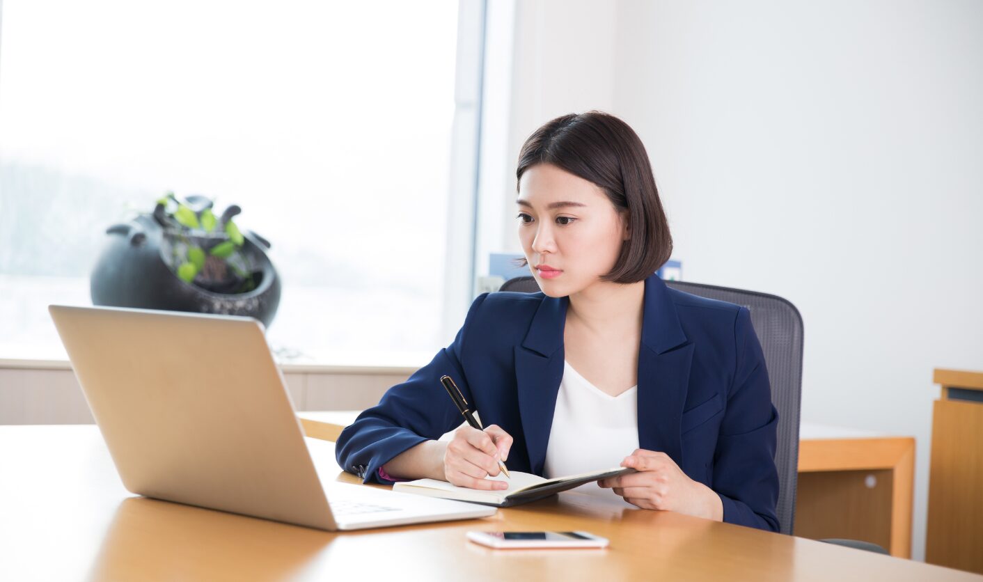 Landlord analysing rental income records on a laptop as part of Making Tax Digital reporting requirements