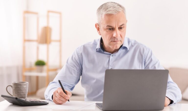 Landlord reviewing tenancy dates and rental figures on a laptop while planning a once-per-year Section 13 rent increase