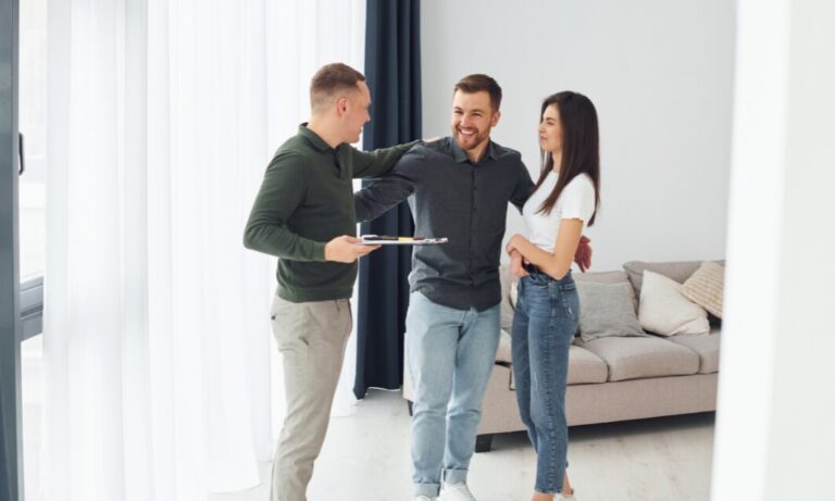 Estate agent showing a rental property to a couple in Tadley RG26