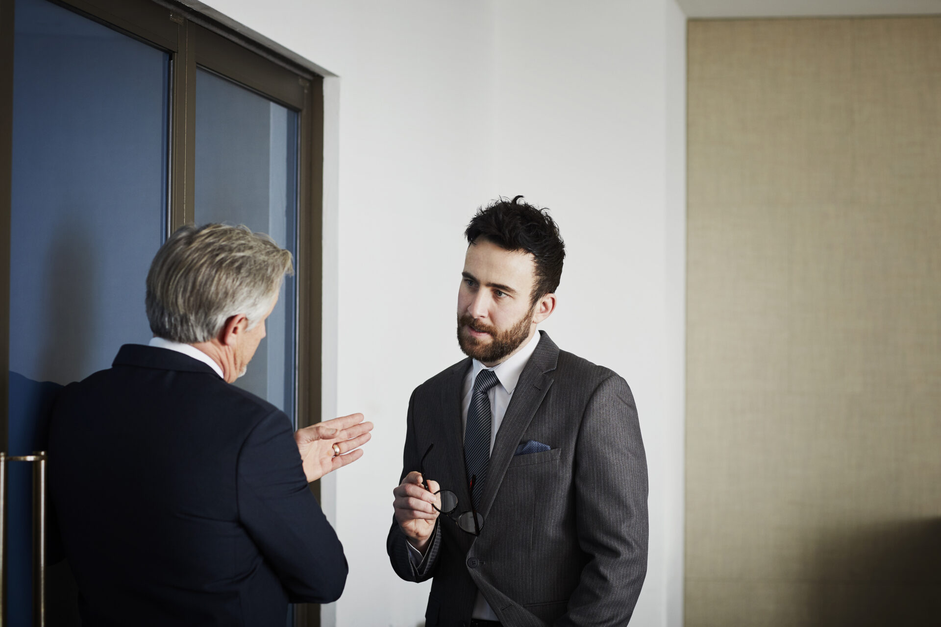 estate agent discussing property details with homeowner about energy rating and sale