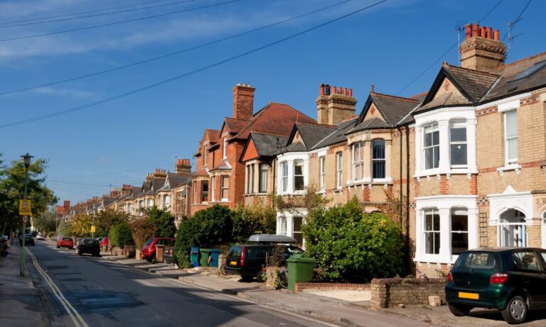 Traditional terraced houses in a residential Wigan street popular with buy-to-let investors seeking strong rental yields.