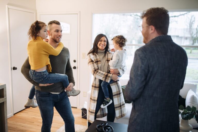 Family speaking with a letting agent while viewing a rental property in Huntingdon near Oxmoor and Sapley