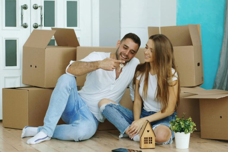 Young couple moving into a new home in Pontypridd representing first-time buyers in CF37 and CF38 during 2026