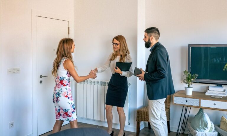 Estate agents greeting a buyer during a property viewing in Newton-le-Willows WA12