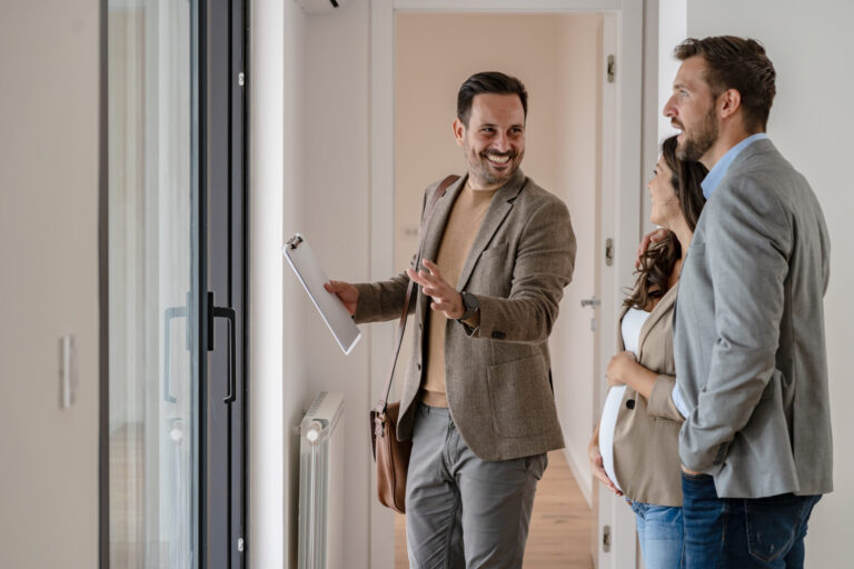 Letting agent showing a property to prospective tenants during a house viewing, representing landlord lettings advice in Christchurch.