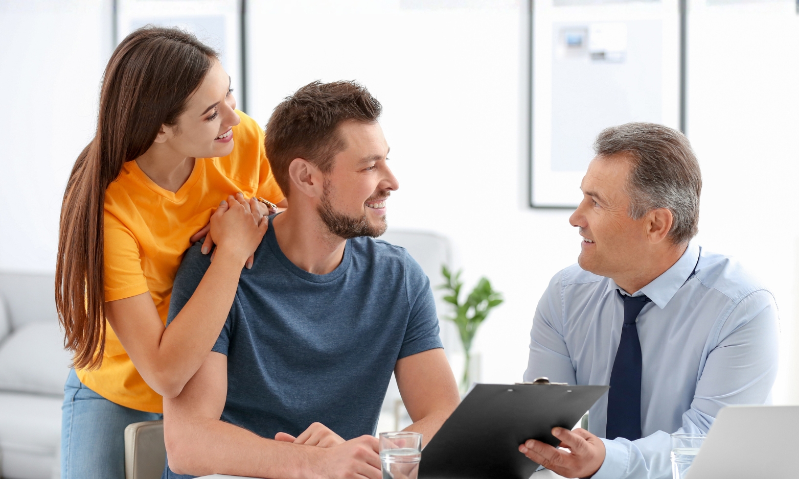 Property consultant advising a couple about buying or renting a home in B79 Tamworth, Staffordshire.