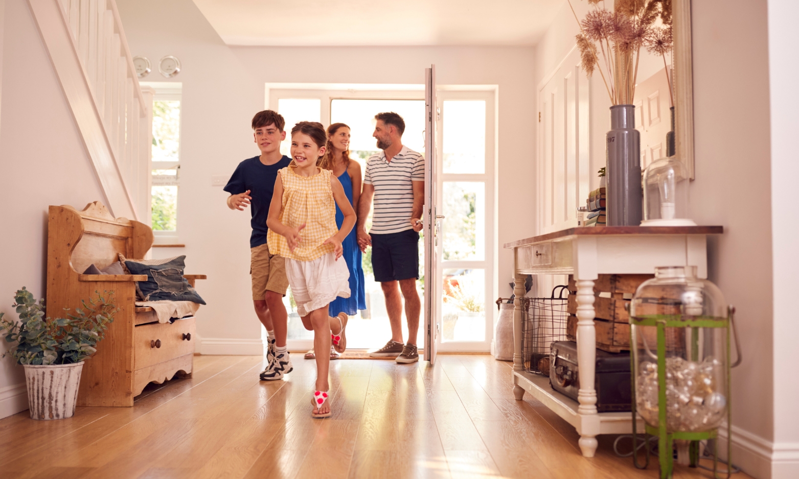 Family moving into a new home in Silchester RG7, highlighting the village's appeal for buyers, renters and families seeking a rural lifestyle.