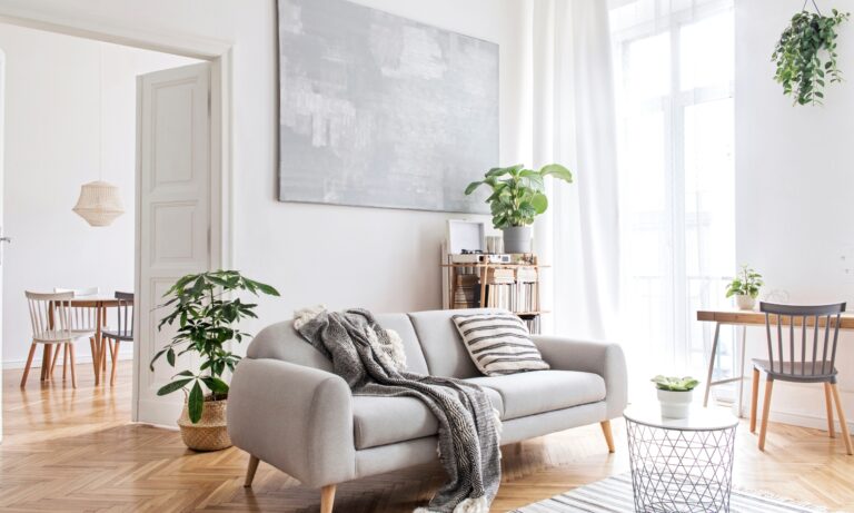 Bright modern apartment living room with contemporary furnishings, illustrating the type of town centre property available in WS1 Walsall