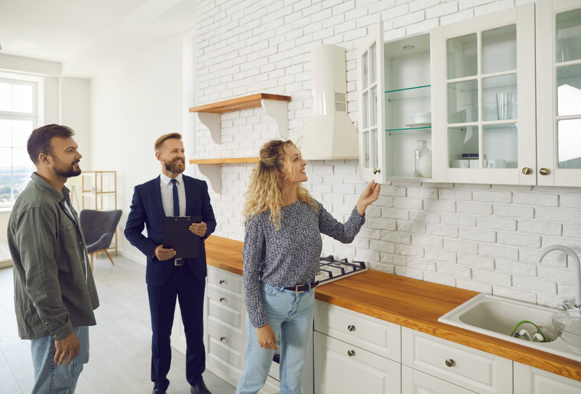 Estate agent showing a rental property to prospective tenants, representing landlord lettings advice in Northwich.