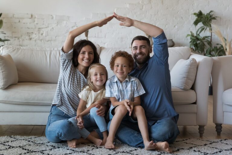 Young first-time buyers viewing a modern home in Gloucester with an estate agent, representing the 2026 property market.
