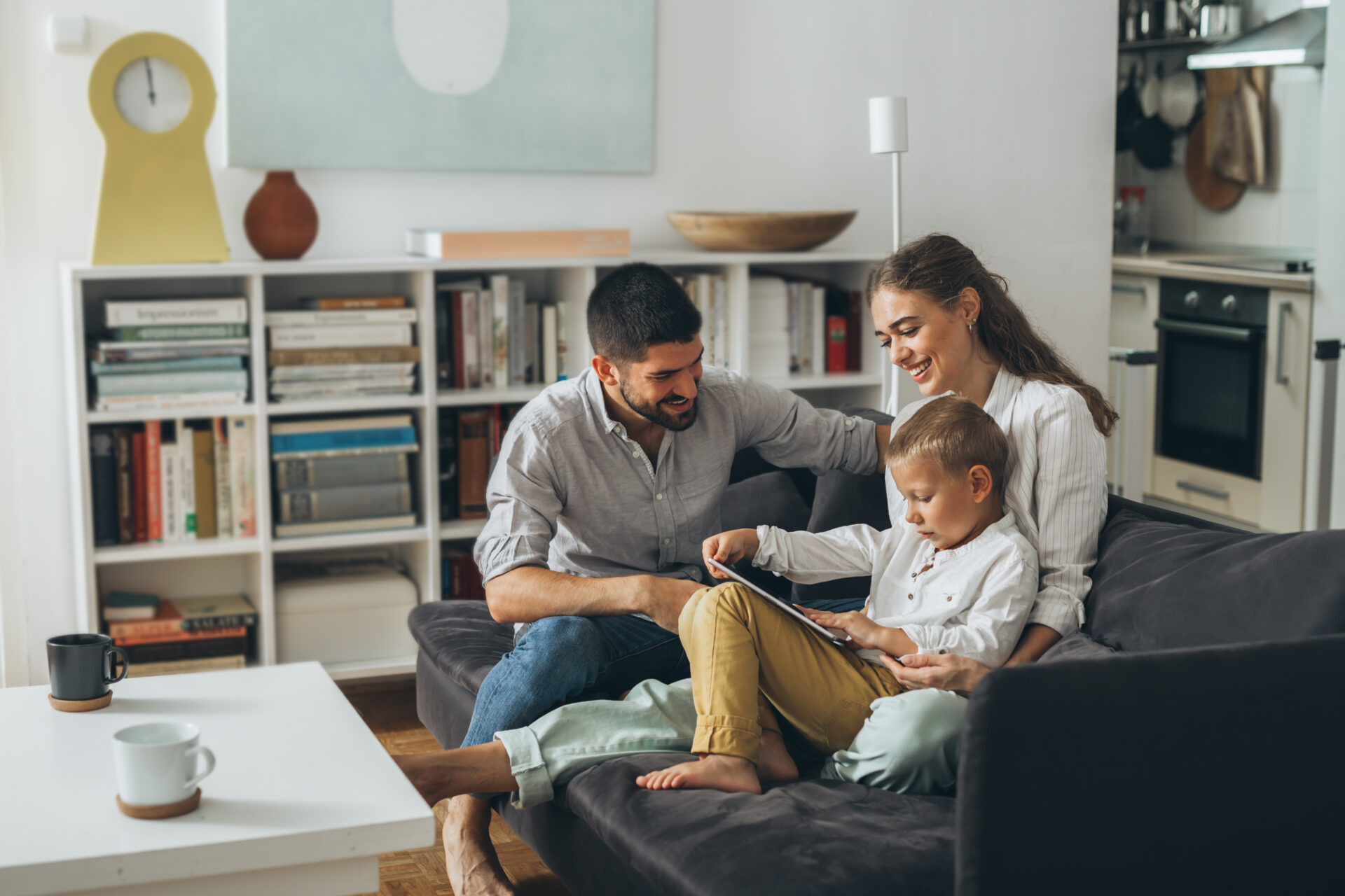 Family sitting together at home, reflecting the experience of homeowners preparing to sell a property in Stone, Staffordshire.