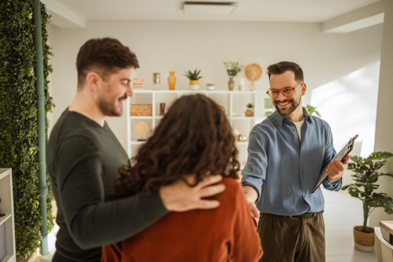 Letting agent meeting tenants in a rental property in Wigan