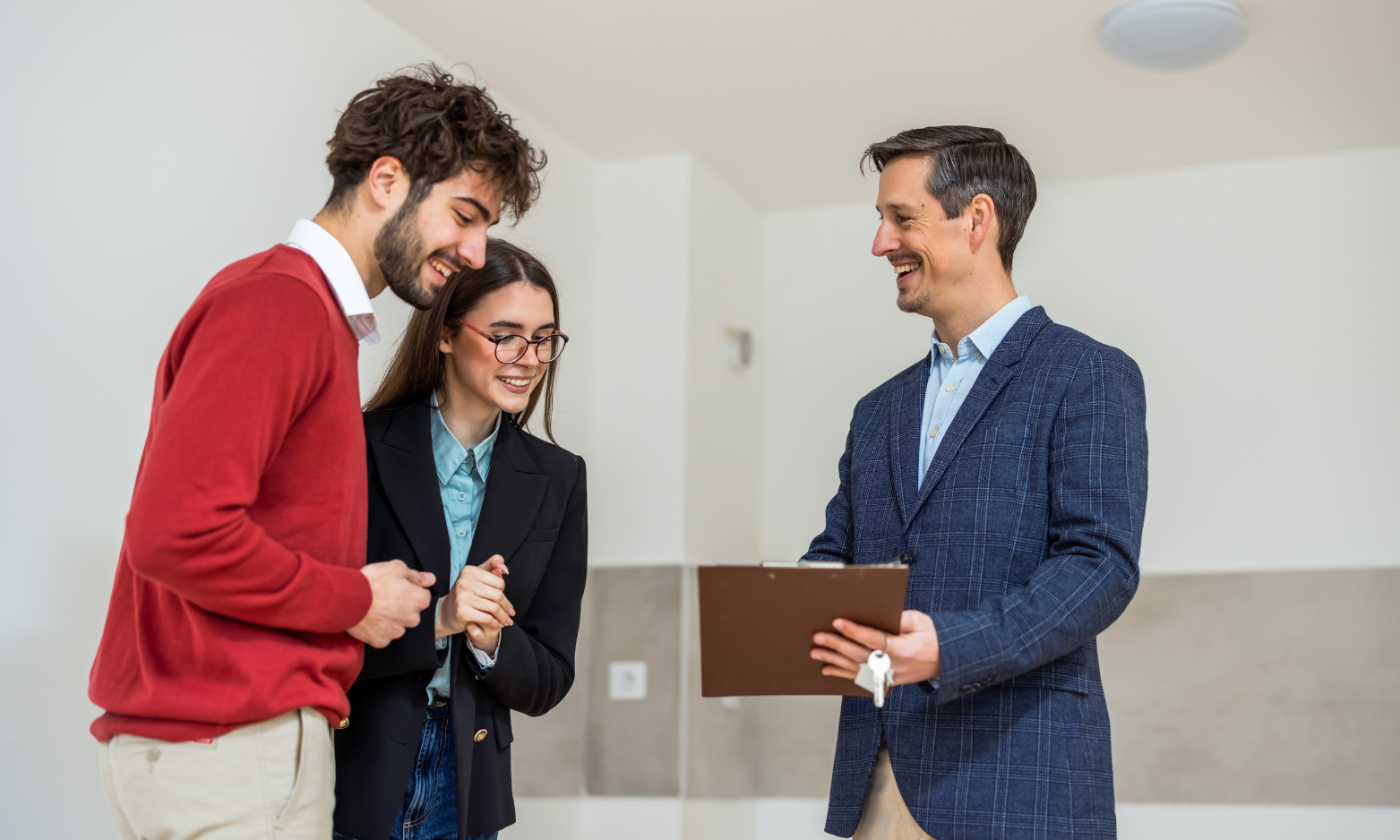Letting agent speaking with a couple during a property consultation