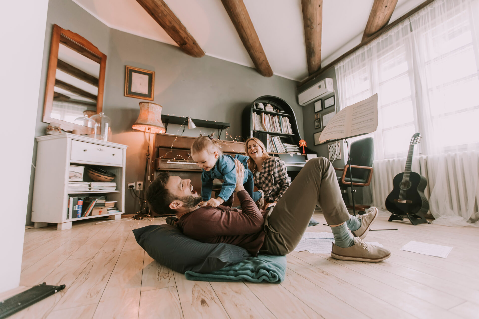 Family with a young child enjoying time together in their home