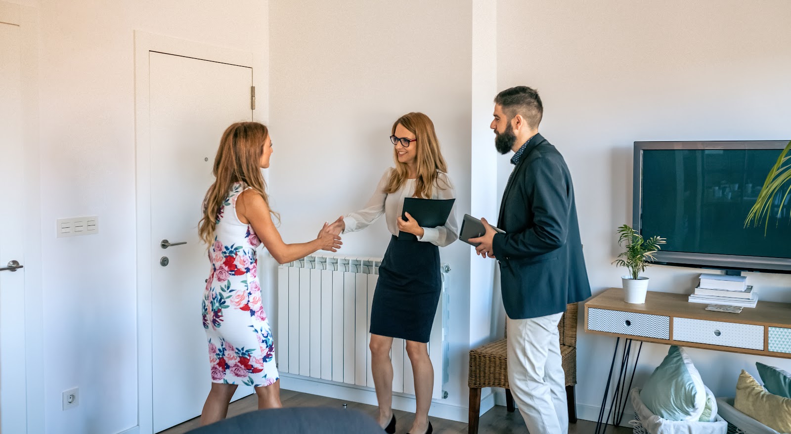 Estate agent meeting buyers at a Drayton Bassett home near Tamworth
