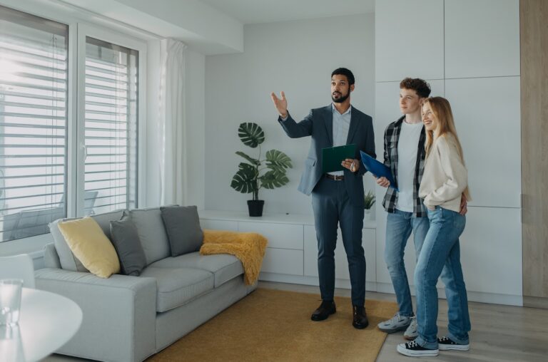 Estate agent showing a home to buyers in Gloucester