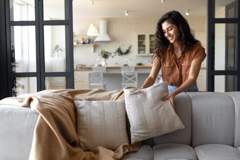 Woman relaxing in a bright, modern apartment living room in Guiseley near Otley Road