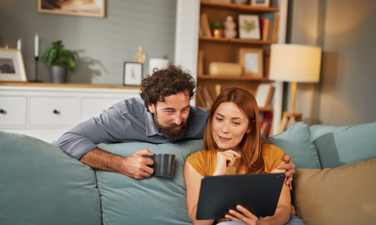 Couple reviewing home buying costs in Tadley