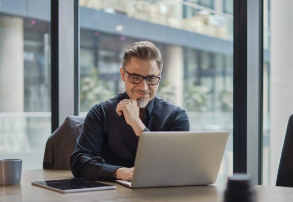 Businessman working with laptop in office